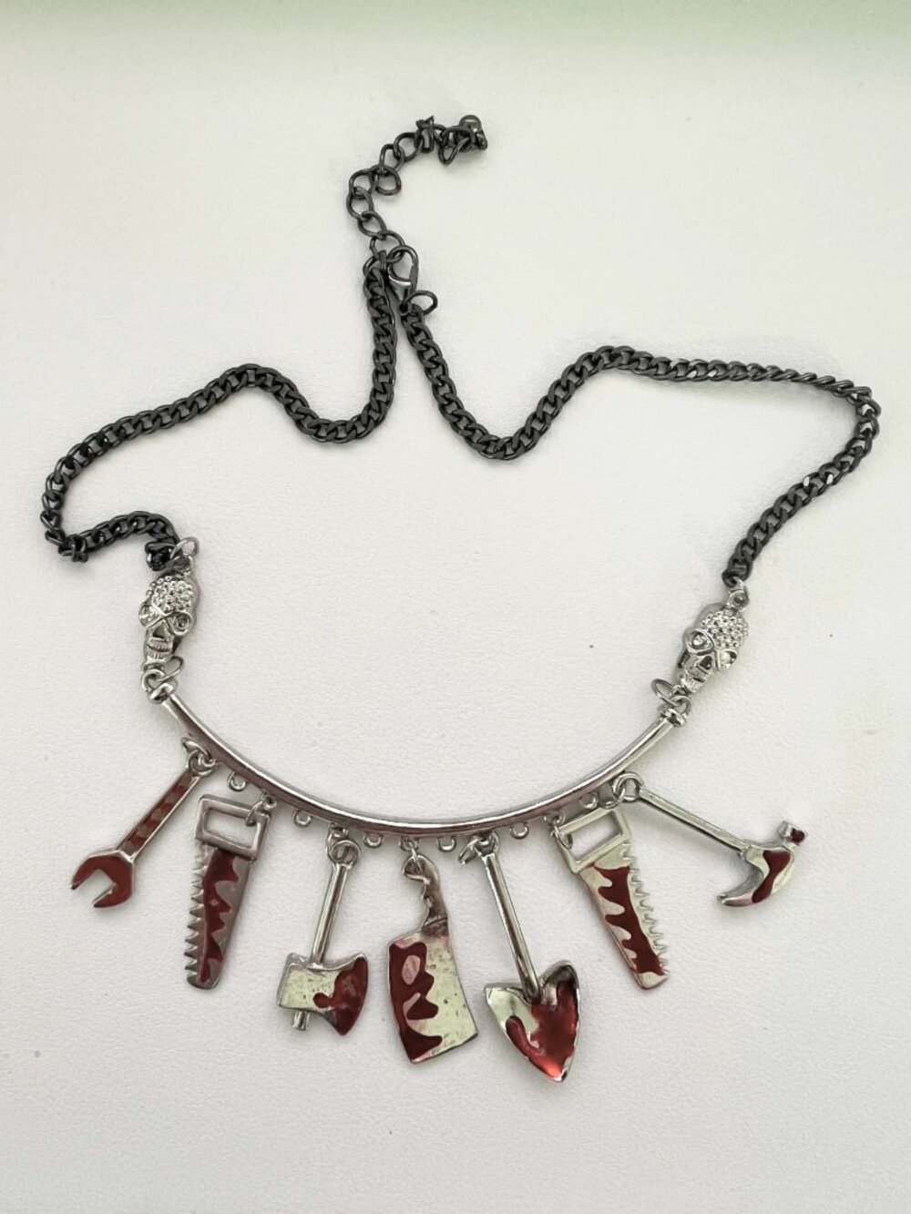 Halloween spooky season bloodsplatter tools skull necklace
